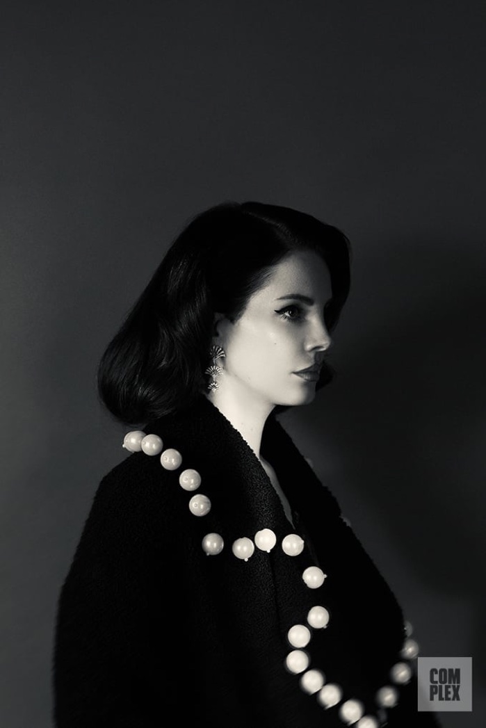 Lana Del Rey wears Maria Lucia Hohan jacket and Maxlor earrings