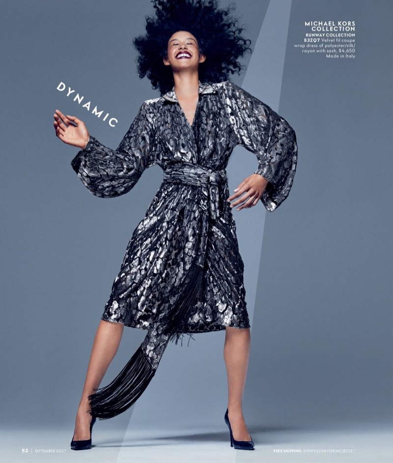 Dilone poses in Michael Kors Collection velvet wrap dress