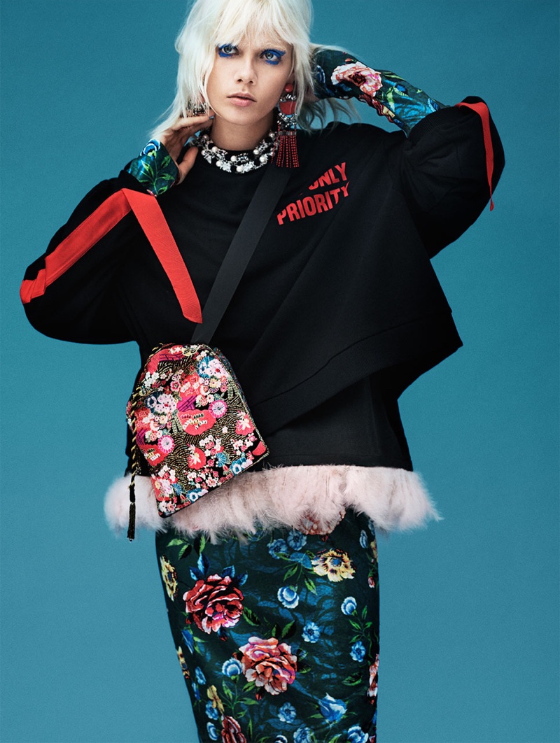 Marjan Zonkman poses in Zara Sweatshirt with Side Straps, Feathered T-Shirt, Floral Print Dress and Bucket Bag