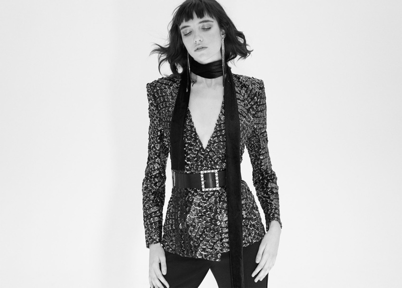 Grace Hartzel wears Zara blazer with sequins, tuxedo trousers, rhinestone fringe earrings and fringe velvet scarf