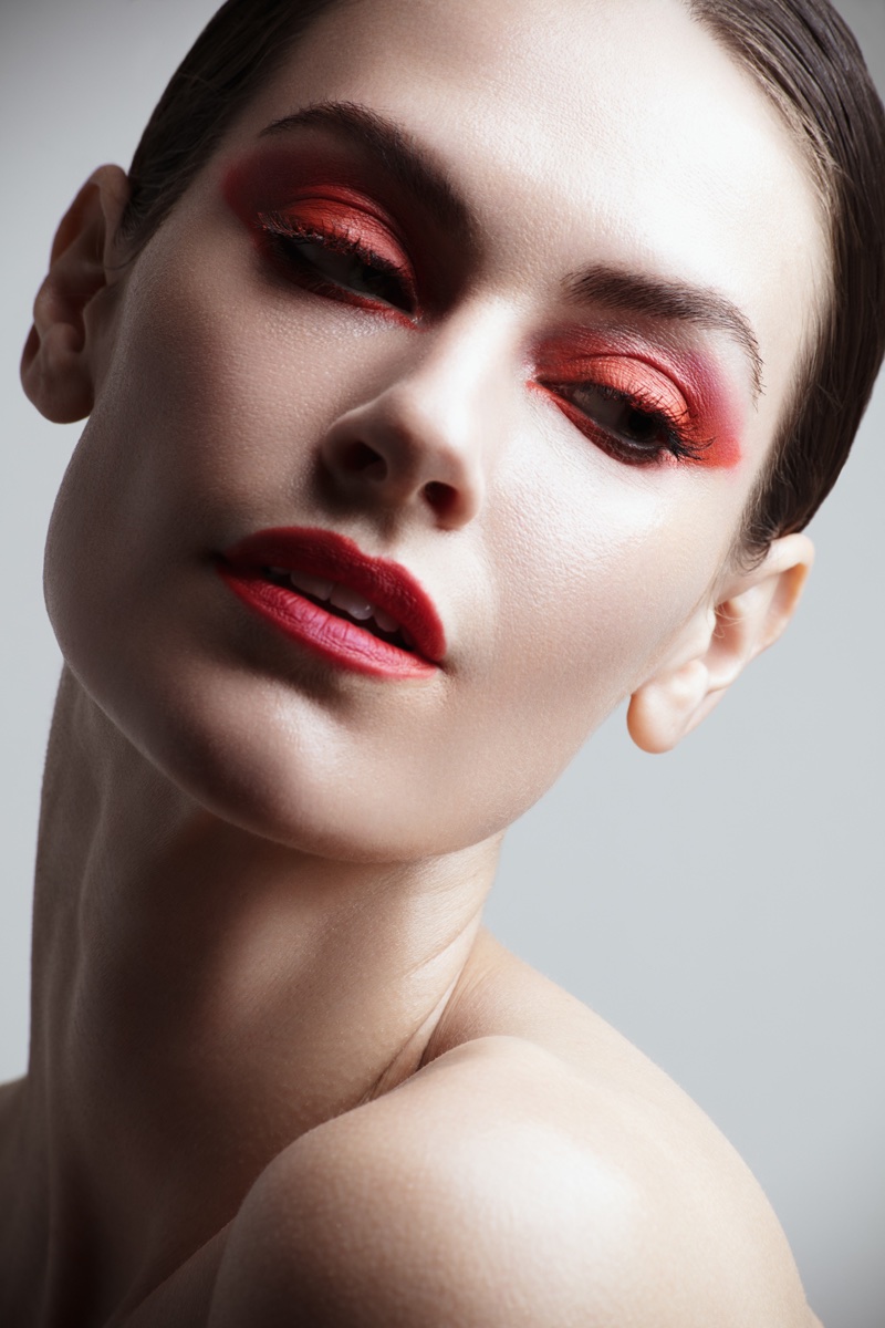 Model Kate Herman wears red eyeshadow with matching lip color. Photo: Jeff Tse