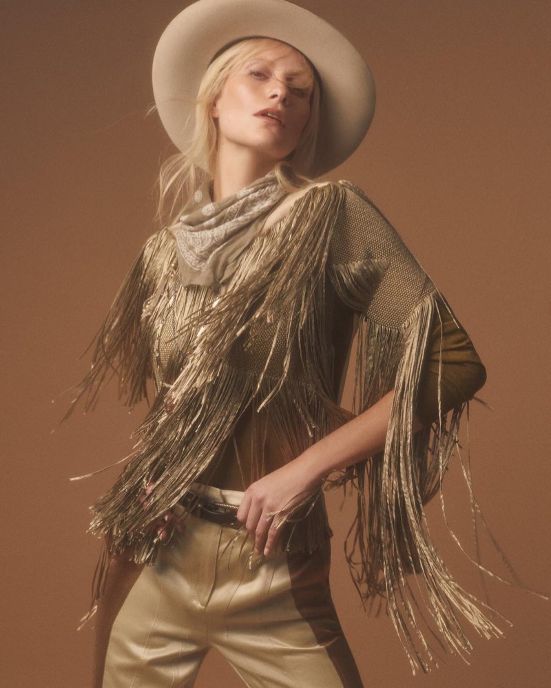 Embracing fringe, Poppy Delevingne poses in Bottega Veneta look