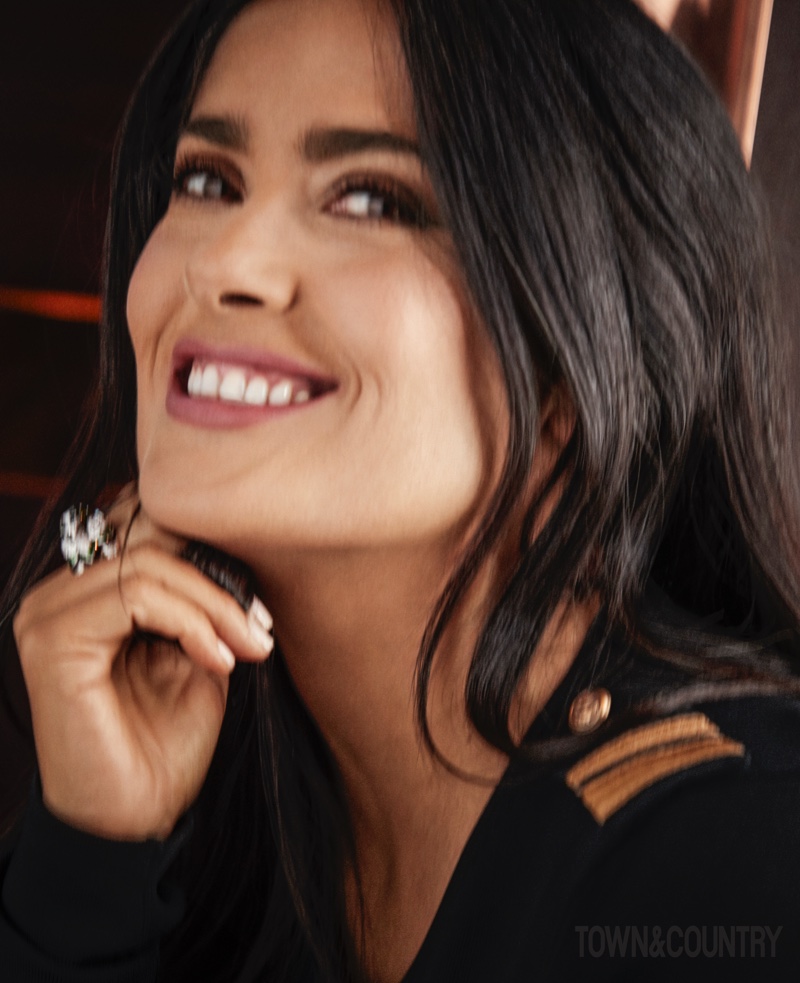 Flashing a smile, Salma Hayek wears a sparkling ring