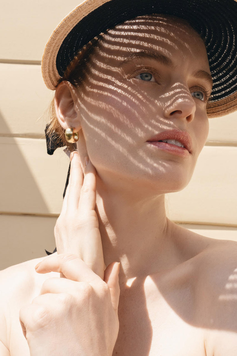 Visor Hat Eugenia Kim, Earrings Laura Lombardi and Coat Allsaints. Photo: Jeff Tse