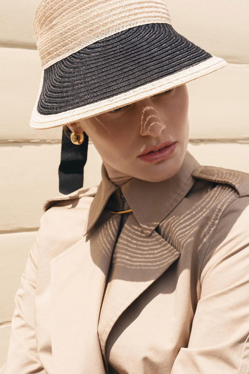 Visor Hat Eugenia Kim, Earrings Laura Lombardi and Coat Allsaints. Photo: Jeff Tse