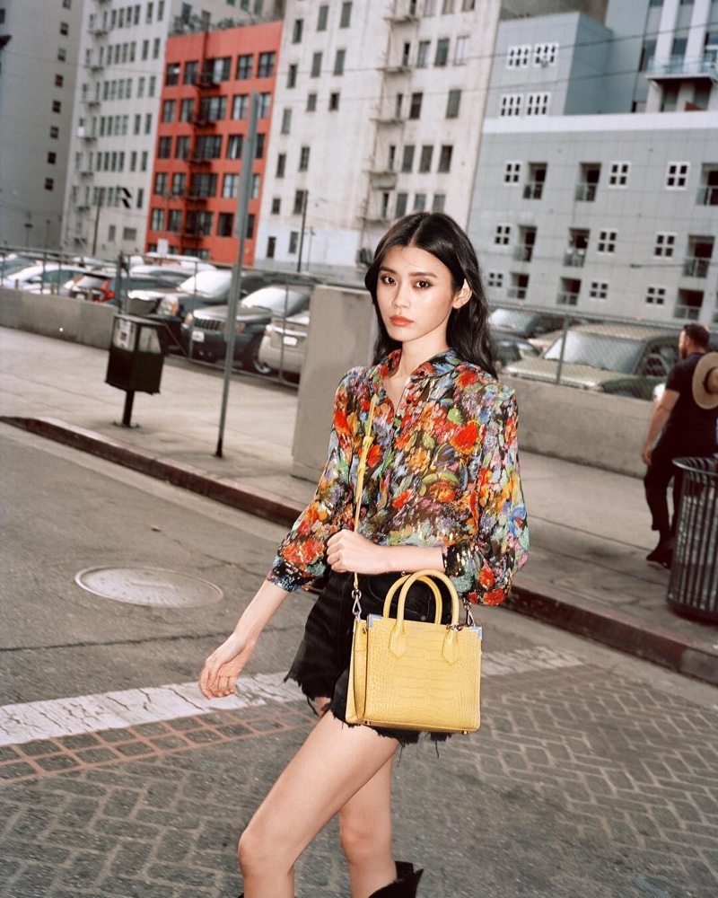 Model Ming Xi collaborates with French label The Kooples on spring 2019 handbag collection