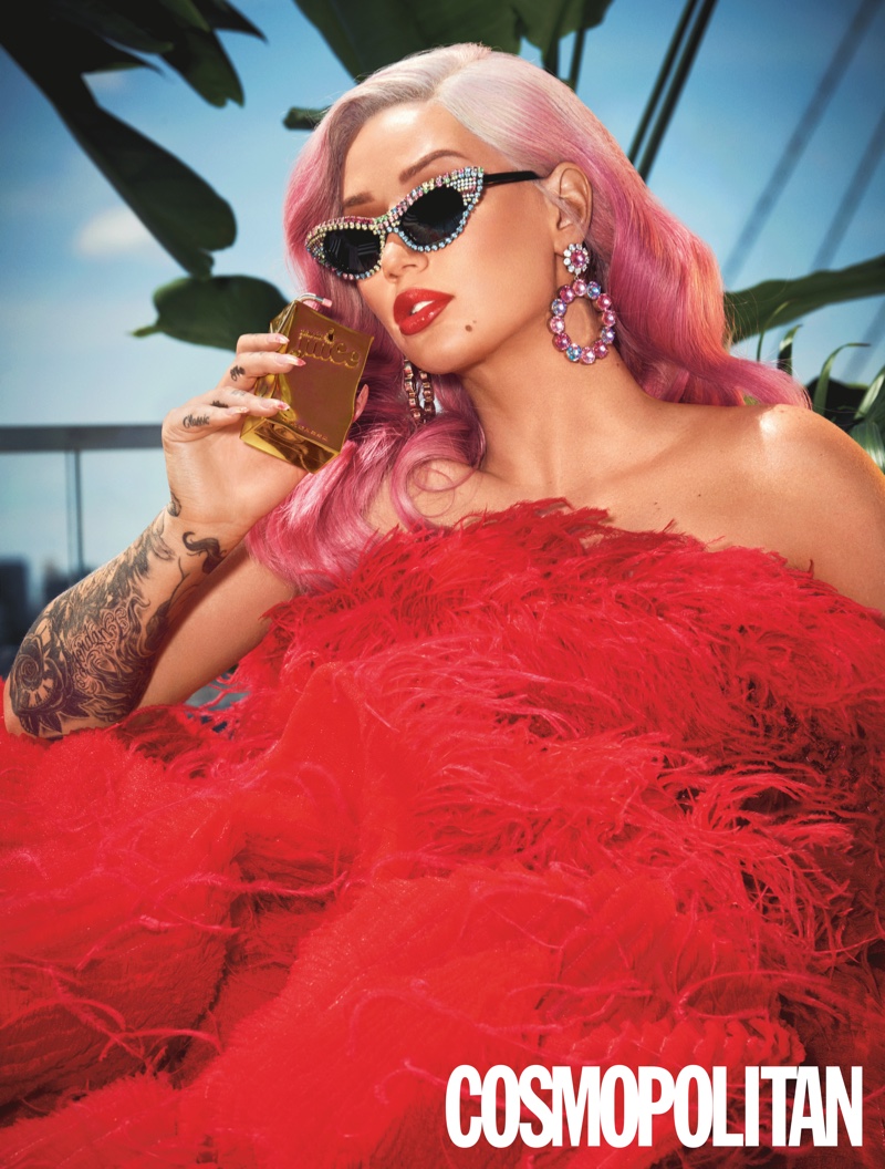 Iggy Azalea poses in Michelle Cinco dress, Mercura NYC sunglasses and Ninon earrings