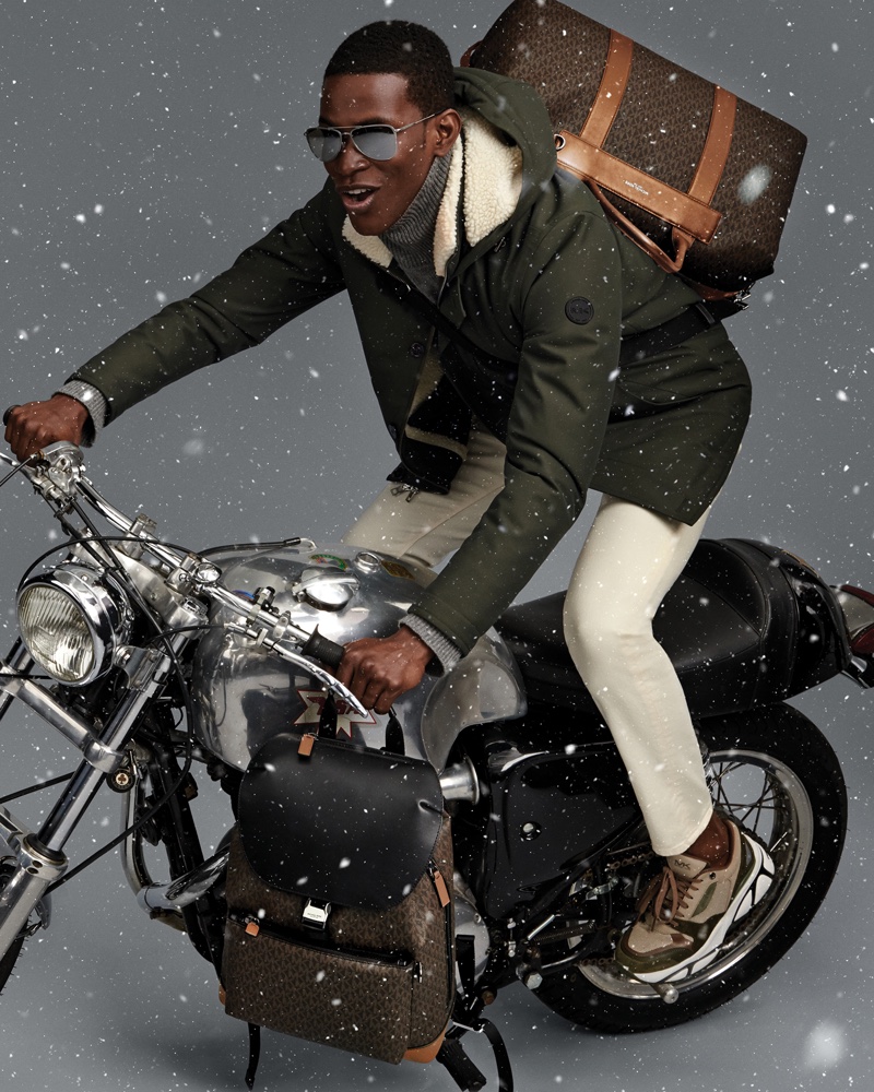 Salomon Diaz rides a motorcycle in Michael Kors Mens holiday 2019 campaign