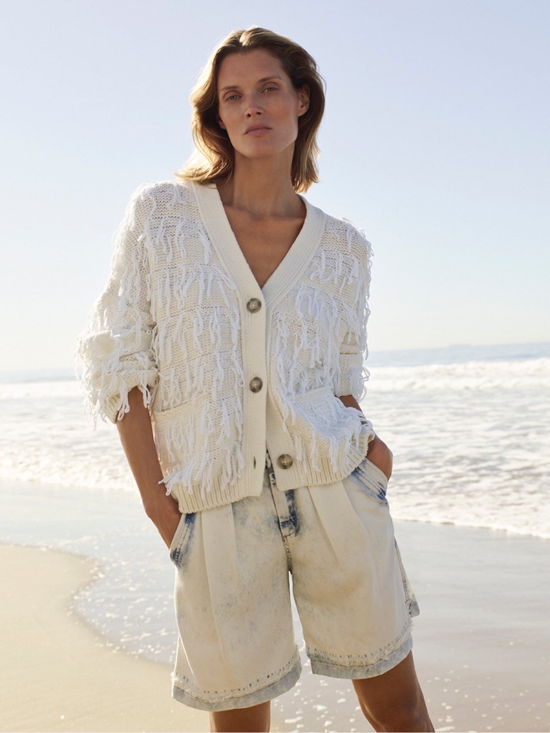 Malgosia Bela wears Closed cardigan and denim shorts