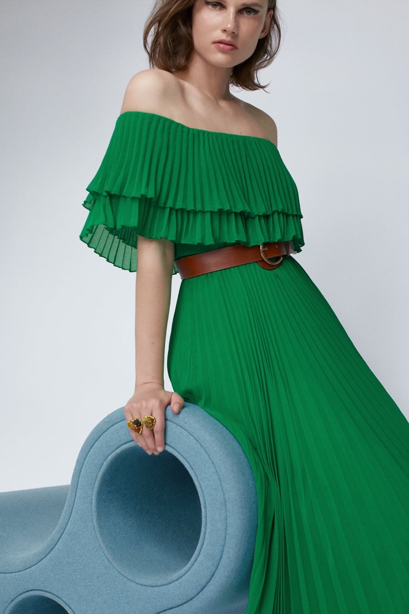 Model Giedre Dukauskaite wears Zara pleated dress with belt.