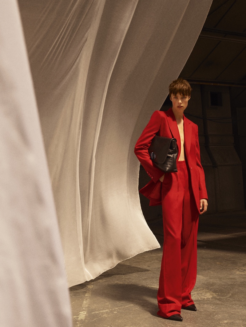 Edie Campbell suits up in red for Massimo Dutti Limited Edition fall-winter 2020 collection.