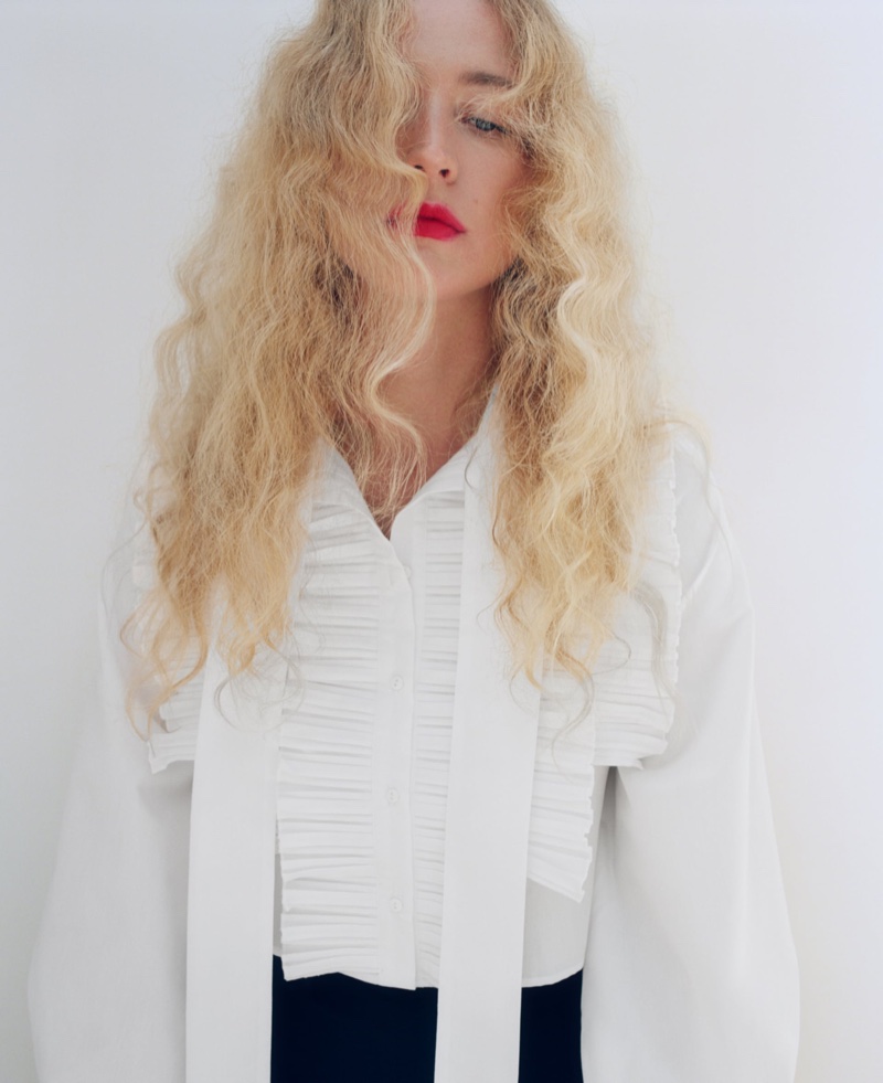 Model Raquel Zimmermann poses in Zara poplin bow shirt.