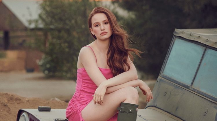 Looking pretty in pink, Madelaine Petsch poses in Prabal Gurung dress and Hunter boots.