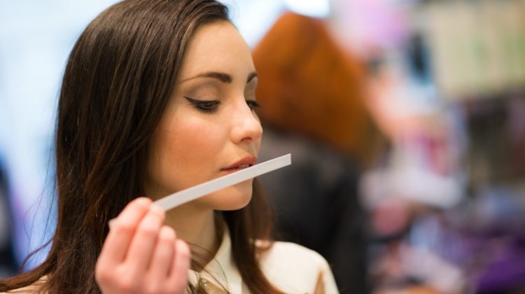 Woman Smelling Fragrances