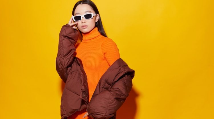 fashion model puffer jacket orange sweater dress