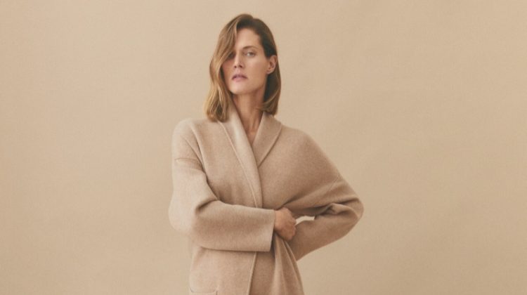 Wearing a long cardigan, Malgosia Bela poses in Mango's winter 2023 arrivals.