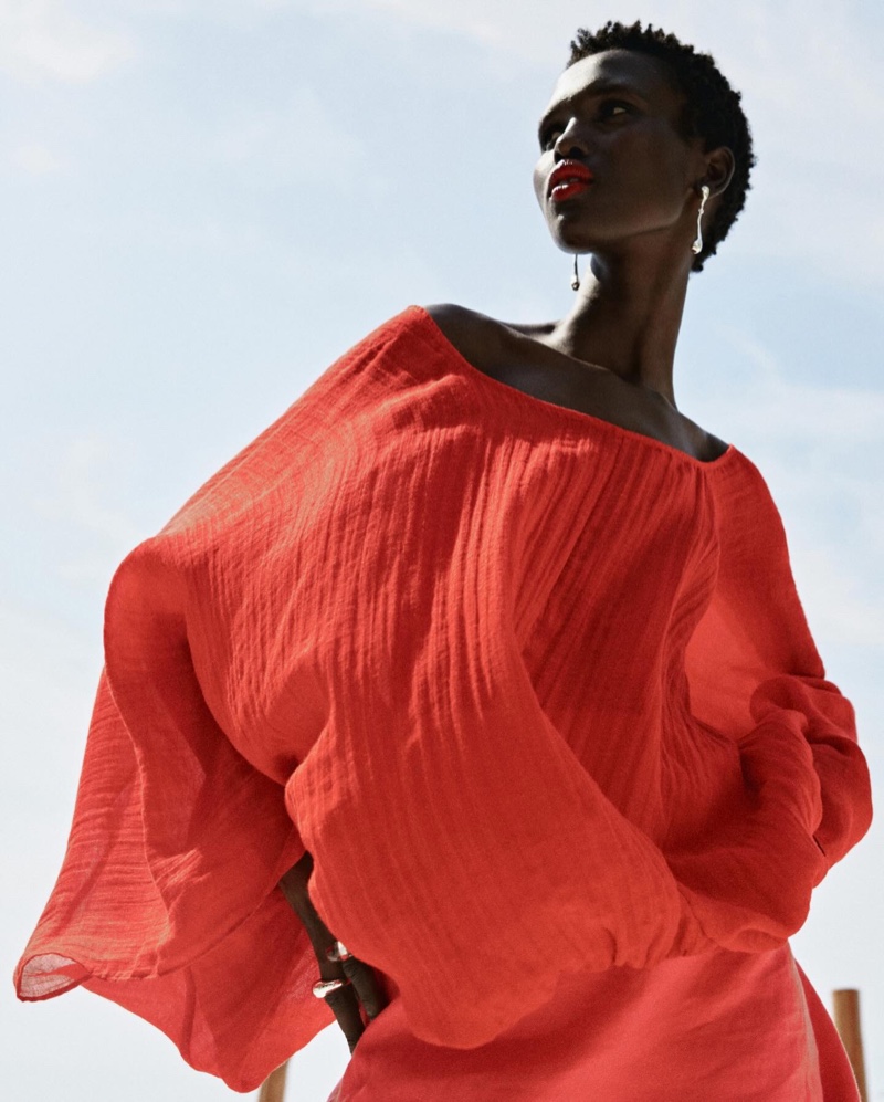 Massimo Dutti's creased-effect voluminous blouse from its Limited Edition collection takes the spotlight in red.