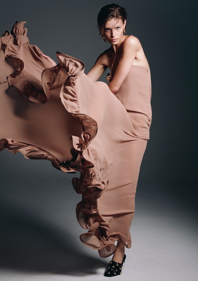 Bibi Breslin models a ruffled dress for H&M's fall-winter 2024 collection ad.