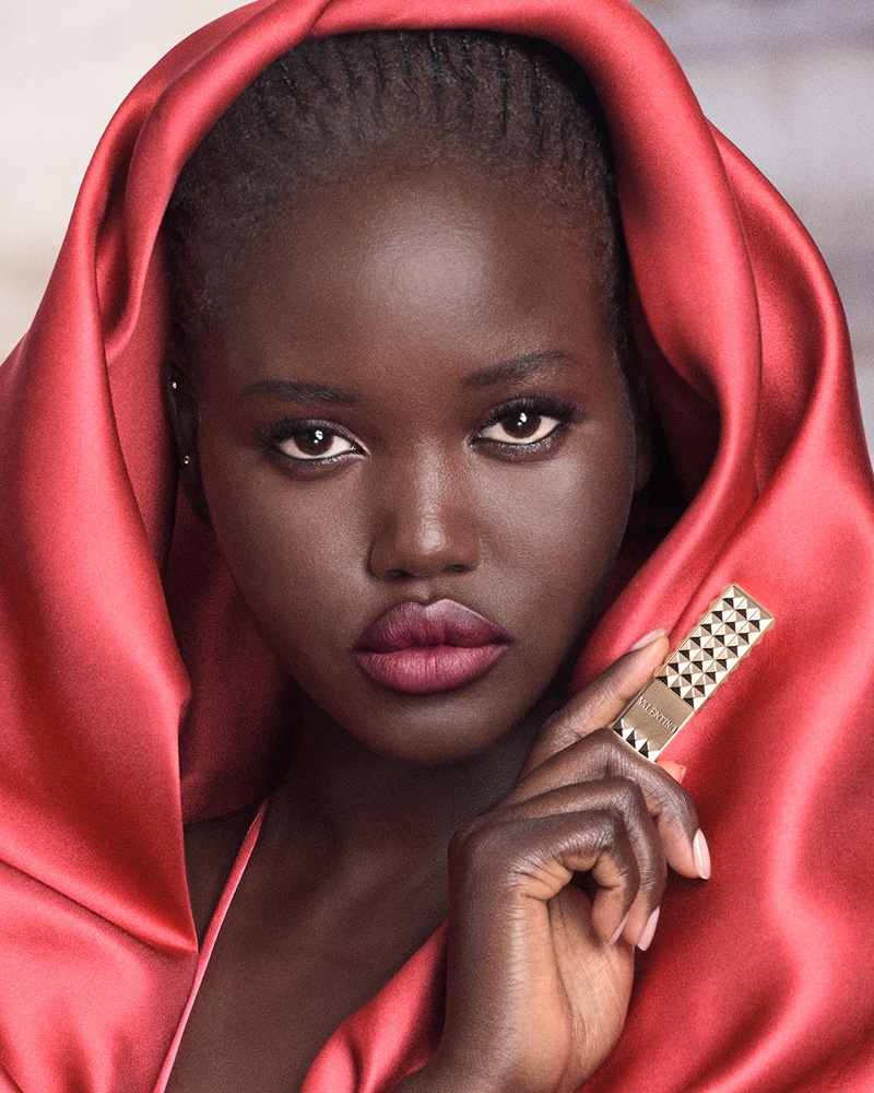 Adut Akech gets her closeup for the Spike Valentino lipstick ad.