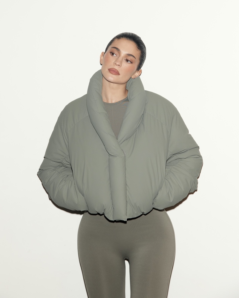 Kylie Jenner wears a dusty olive puffer jacket from the KHY x Entire Studios collection.